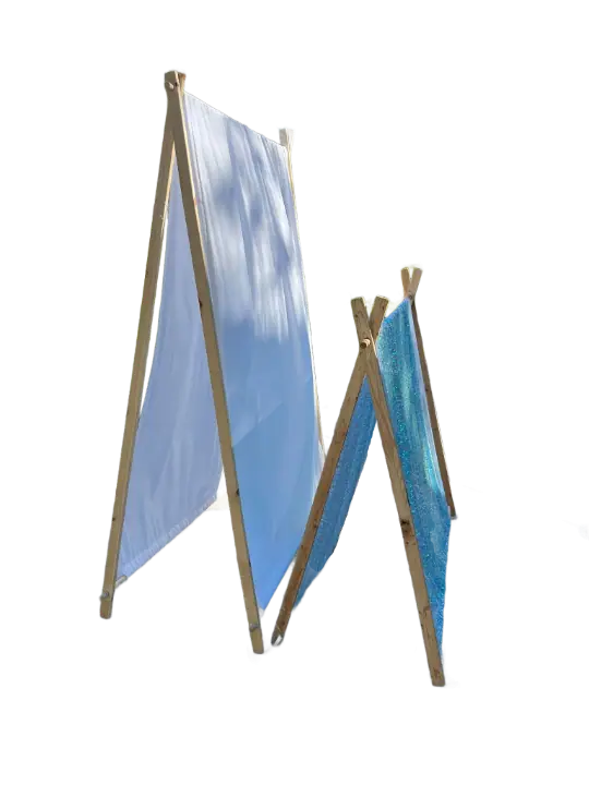 Two cloth sheets are hung between wooden frames, one significantly larger than the other, both angled to form an A-frame structure, perfect for a kids party rental.
