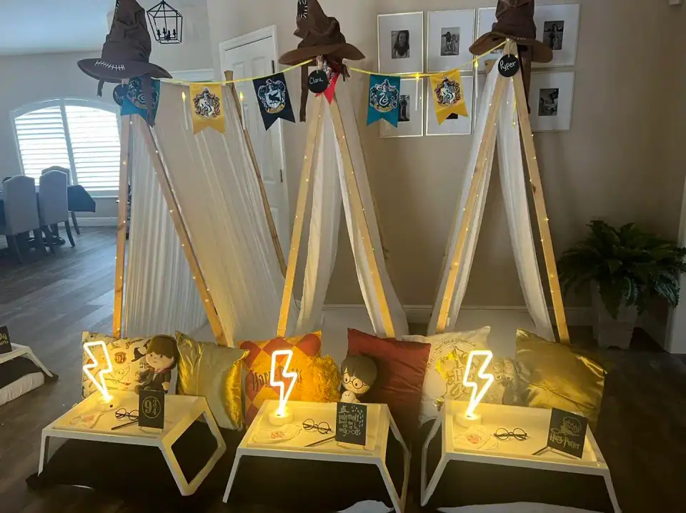 The Harry Potter Theme includes three indoor teepee tents with Hogwarts house banners, themed pillows, and lightning bolt lamps—ideal for a magical sleepover or kids party rental in Florida.