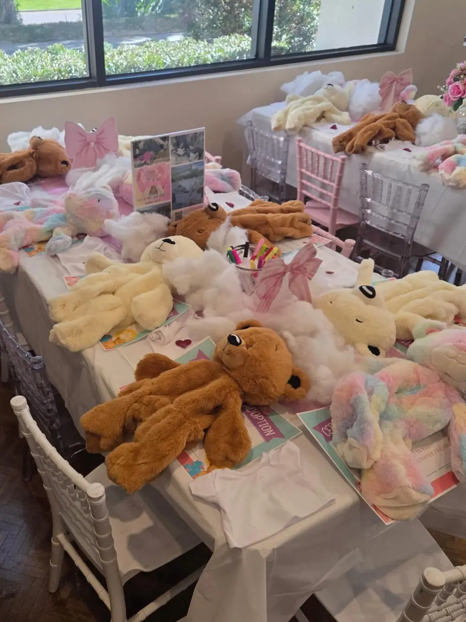 Kids stuffing bears at a build-a-bear party table