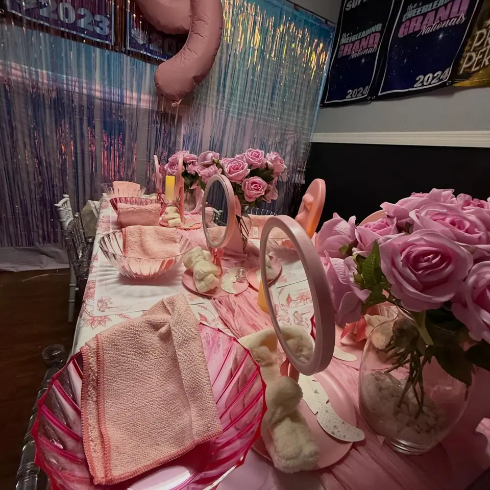 Spa party table with pink mirrors and roses