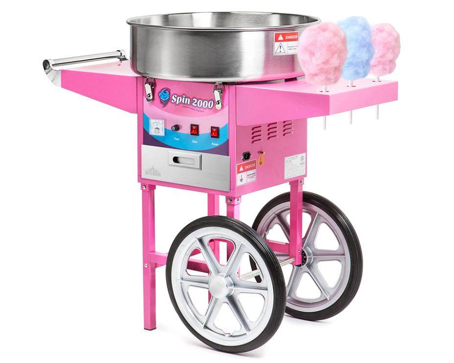 A pink commercial cotton candy machine with large wheels and a stainless steel bowl, perfect for birthday party upgrades, displaying two fluffy sticks of blue cotton candy.